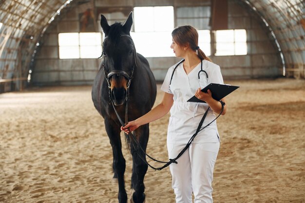 holding-notepad-with-results-check-up-female-doctor